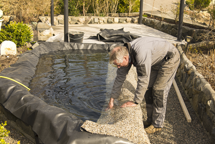 Man building pond